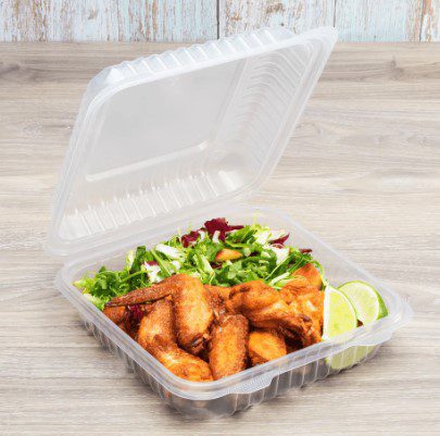 Takeout container with fried chicken and salad